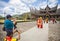 Tourists in traditional clothes posing in front of Istana Basa Pagar Ruyung, landmark of West Sumatera, Indonesia.