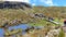 Tourists on the trail through valley of Toreadora lake.  Cajas National park, Ecuador