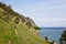 Tourists travel along the Great Baikal Trail. View above big beautiful lake, Baikal lake, Russia