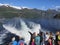 Tourists travel to the Geiranger fjord on a cruise ship