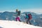 Tourists travel together in the mountains in winter. two girls snow-capped mountains