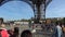 Tourists under the Eiffel Tower