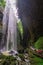 Tourists under waterfall in Wulong National Park