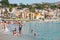 Tourists on urban beach in Giardini Naxos city