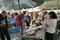 tourists of various nationalities shop in the characteristic market of typical products in Potamos, Greece