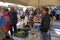 tourists of various nationalities shop in the characteristic market of typical products in Potamos, Greece