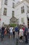 Tourists view Manneken Pis dressed as a shepherd`s suit