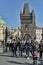 Tourists view Prague from Charles Bridge