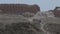 Tourists view the ruins of an ancient city, archaeological excavations in desert