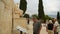 Tourists view statue of famous ancient Greek dramatist Menandre, sculpture art