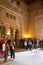 Tourists viewing the Islamic architecture of the Alcazar in Seville, Spain