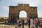 Tourists visit the archeological Berber city of Volubilis. Unesco world heritage site