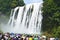 Tourists Visit China Guizhou Huangguoshu Waterfall in Summer.