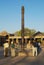 Tourists visit the Iron Pillar at the Qutb Minar complex in Delhi, India.