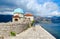 Tourists visit Island of Virgin on Reef Gospa od Skrpela Island, Montenegro