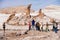 Tourists visit Las tres Marias Three Marys formation rocks in Valle de la Luna in San Pedro de Atacama, Chile.