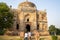 Tourists visit Shish Gumbad, also spelt Shisha Gumbad, a tomb from the last lineage of the