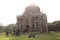 Tourists visit Shish Gumbad, also spelt Shisha Gumbad, a tomb from the last lineage of the