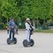 Tourists visiting the city near the Eiffel Tower during their guided Segway tour of Paris.