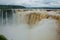 Tourists visiting the Devil s throat waterfall in the Iguazu Falls, one of the seven natural wonders of the world. Missions,