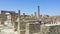 Tourists visiting the restored ruins of Pompeii city