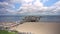 Tourists Visiting Sellin Pier and Walking on Soft White Sandy Beach on Ruegen Island