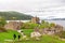 Tourists visiting Urquhart Castle on shores of Loch Ness, Scotland