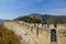 Tourists walk along the ancient Great Wall of China on a sunny autumn day.