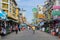 Tourists walk along backpacker haven Khao San Road