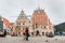 Tourists walk along the Town Hall Square in summer. Sightseeings of Riga. House of the Black Heads