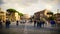 Tourists Walk Along Via dei Fori Imperiali With Colosseum in Rome