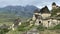 Tourists walk through the ancient village of Dargavs - the City of the Dead