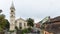 Tourists walk around the square near Roman Catholic Church - Citadel in the castle of old city. Sighisoara city in Romania