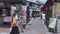 Tourists walk around Yufuin`s main shopping street