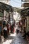 Tourists walk through the bazaar along David Street and look at souvenirs near to Jaffa Gate in the old city of Jerusalem, Israel.