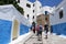 Tourists walk through the beautiful streets of Kasbah des Oudaias in the city of Rabat, Morocco.