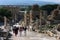 Tourists walk down Curetes Way at the ancient site of Ephesus in Turkey.