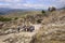 Tourists walk through the Lion`s Gate of Mycenae citadel