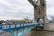 Tourists walk over Tower Bridge in London, UK