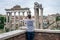 Tourists walk and take pictures in the photo on the tour of the ancient ruins of the ancient imperial capital of the Roman Forum i