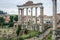 Tourists walk and take pictures in the photo on the tour of the ancient ruins of the ancient imperial capital of the Roman Forum i