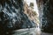 Tourists walking in Alcantara Gorge and Alcantara river park in Sicily Island, Italy.