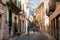 Tourists walking along at historical town part of Soller with its traditional house