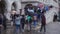 Tourists walking on arched bridge in Venice, Italy while holding umbrellas