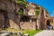 Tourists walking by the archway at Via Nova on the ancient Roman Forum in Rome