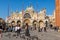 Tourists are walking around the Basilica di San Marco in Venice