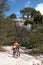 Tourists walking with bycicles in touristic itinerary of national forest park