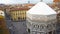 Tourists are walking in the center of Florence. Top view of the square in front of the Battistero di San Giovanni