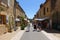 Tourists walking down the main street in the Bastide town of Domme in the Dordogne region of France