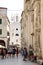 Tourists walking in front of the St James Cathedral and St Barb